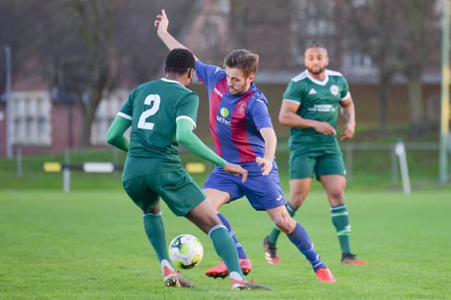 Dec Seiden takes on a Brockenhurst opponent during US Portsmouth's FA Vase. Pic: Martyn White.