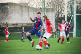 US Portsmouth midfielder Florjet Vucaj about to make a challenge during the win against Cowes. Picture: Nathan Lipsham.