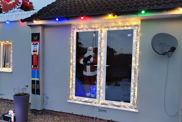 John and Mak Mumby from Cowplain have transformed the front of their home into Christmas wonderland to raise money for the Rowans Hospice