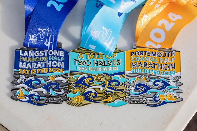 Runners who completed both half marathons over the weekend received a bonus third medal. Picture: Mike Cooter (180224)