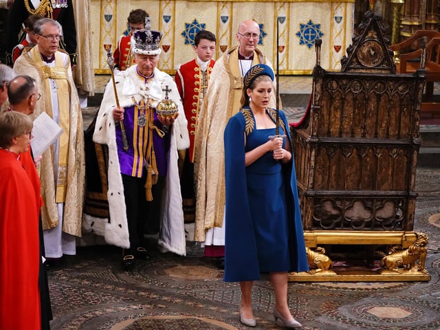 Penny Mordaunt became the first woman to carry and present the ceremonial swords.
