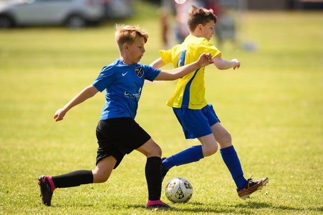 Action from the Clanfield youth football tournament at Horndean Technology College. Picture: Keith Woodland (270521-334)