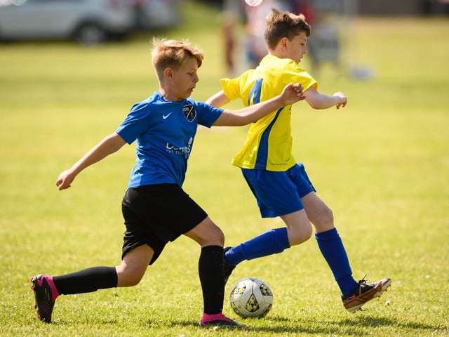 Action from the Clanfield youth football tournament at Horndean Technology College. Picture: Keith Woodland (270521-334)