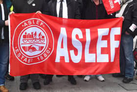 A flag on an Aslef picket line. Train drivers at eight rail companies are to stage a 24-hour Saturday strike later this month in pay disputes, threatening more disruption to services.