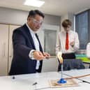 Alan Mak MP joins pupils to take part in a science experiment at Park Community School