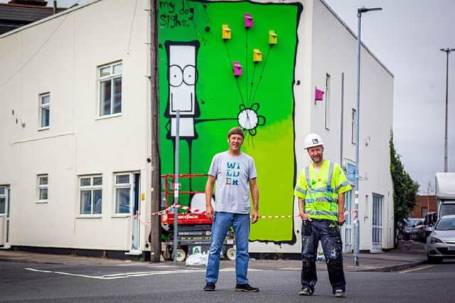 Artist MyDogSighs, painting a new mural on the Portsmouth Carers building on Francis Avenue, Portsmouth on behalf of Wilder Portsmouth on 28 September 2020

Pictured: Andy Ames of Wilder Communities with artist, MyDogSighs in front of the mural.

Picture: Habibur Rahman