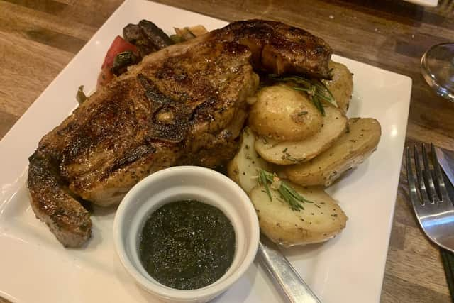 Grilled lamb cutlets served with garlic and rosemary potatoes and seasonal vegetables.