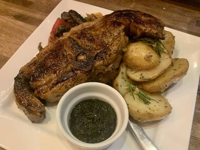 Grilled lamb cutlets served with garlic and rosemary potatoes and seasonal vegetables.