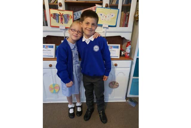 Kobe Brown, 7, is running a mile a day to raise money for Parkinson's UK because his grandad has the neurological condition. Pictured: Kobe and his twin sister Orla