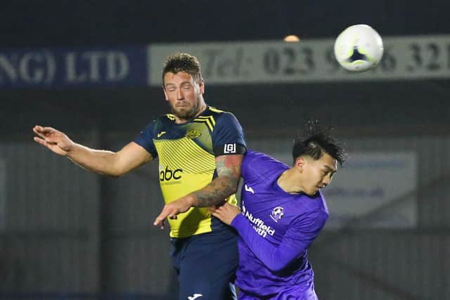 Moneyfields striker Steve Hutchings in aerial action against AFC Stoneham. Picture by Nathan Lipsham