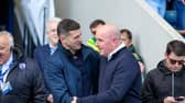 John Mousinho and former Pompey boss Paul Cook during Sunday's FA Cup clash at Chesterfield. Picture: Simon Davies/ProSportsImages