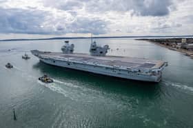 HMS Prince of Wales will be returning to Portsmouth despite a weather warning being issued. Pictured is her leaving Portsmouth Harbour on September 4.