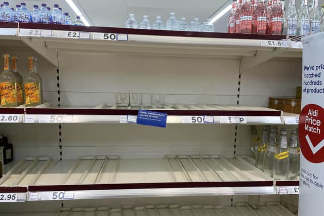 Empty shelves in the drinks section of a branch of Tesco. Picture: Peter Byrne/PA Wire