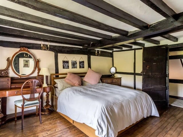 The listing says: "Enjoying established secluded gardens, a delightful Grade II listed country cottage featuring a host of period features and offering adaptable accommodation that includes an annexe."