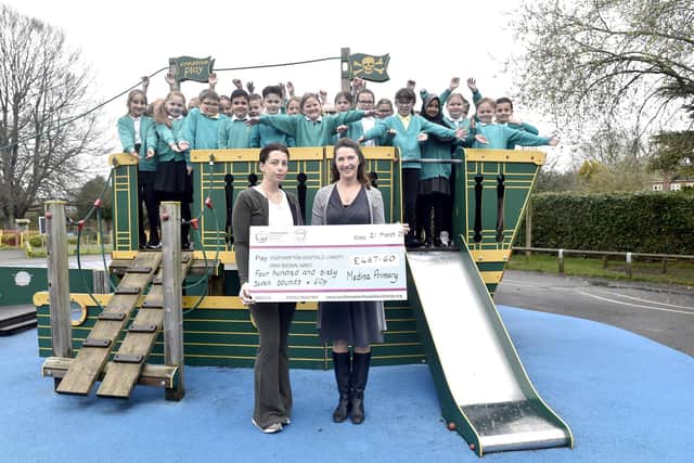 On the day of Ace Rewcastle's funeral, Medina Primary School paid their respects by having a "Blue Day" to celebrate his memory and raise money for the PIAM Brown ward at Southampton General Hospital. On Tuesday, March 21, Medina Primary School and Ace's mum Amber Field presented the cheque of £467.60.Pictured is: Year 4 with (front l-r) Ace's mum Amber Field and Rachel Funnell, charity co-ordinator for the PIAM Brown ward at Southampton Hospitals Charity.Picture: Sarah Standing (210323-1304)