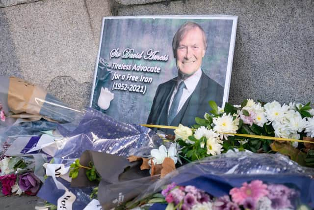 Flowers left in memory of Sir David Amess outside the Houses of Parliament. Picture: Dominic Lipinski/PA Wire