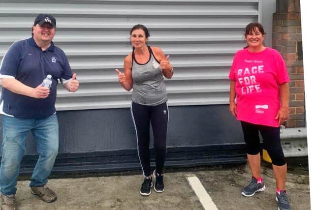 (left to right) Darren Elmes, Andrea Sellar and Tina Penn after completing their running challenge.