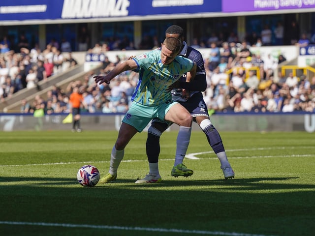 Pompey's Colby Bishop battles with Millwall defender Japhet Tanganga at The Den. Picture: Jason Brown/ProSportsImages