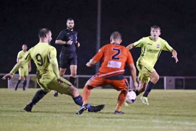 George Colson of AFC Portchester (orange) and Connor Duffin. Picture: Barry Zee