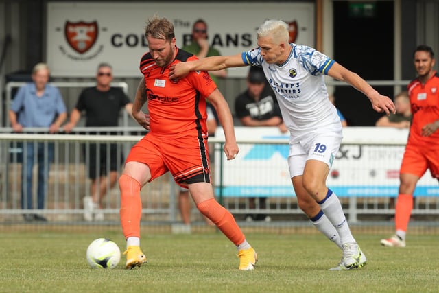 Portchester's Sam Pearce and Hawks striker Danny Wright. Picture by Dave Haines