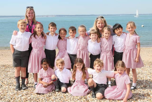 Mrs Jennings (left) with Portsmouth Grammar School students.