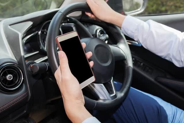 Drivers face fines of £200 for using phones for any reason while driving