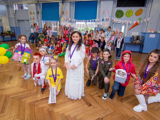 Pupils of Kings Academy Junior School, Crofton Road, Portsmouth celebrating in their school hall