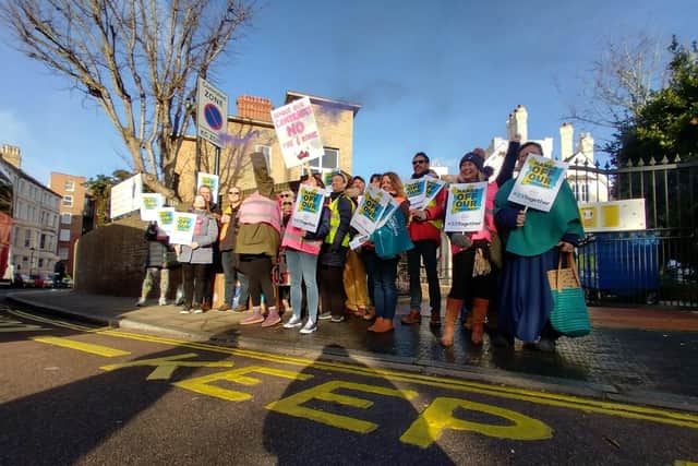 Portsmouth High School teachers outside the school as they go on strike.