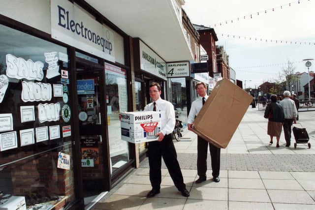 David Halewood (left) and Peter Owens of Electronequip carry boxes into the store in West Street in May 1992.