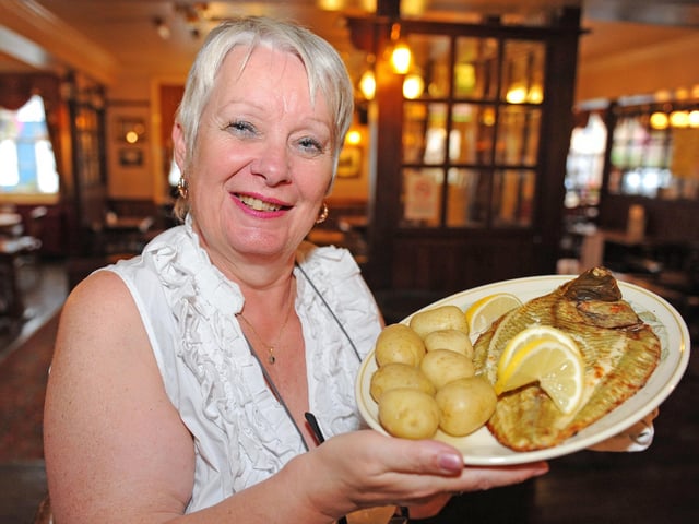 Landlady Carol Frewing with the whole grilled local plaice main dish on the menu in 2011 (112647-5294)