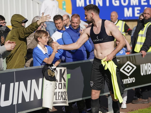 This young Pompey fan was lucky enough to get Clark Robertson shirt at the final whistle.