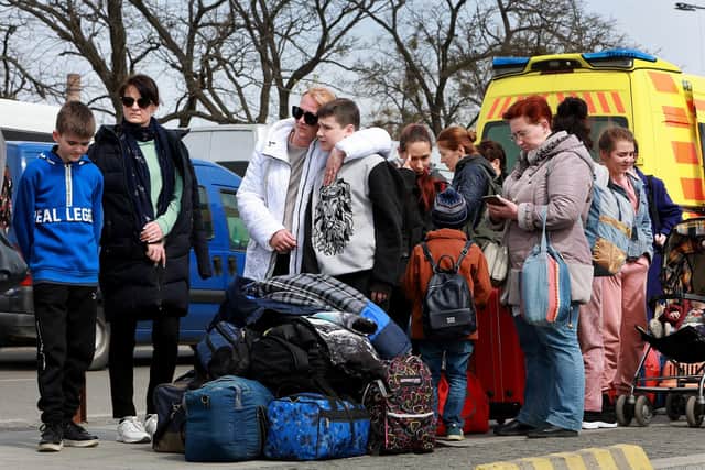 Refugees waing for a bus in Lviv, Ukraine. Picture: Joe Raedle/Getty Images