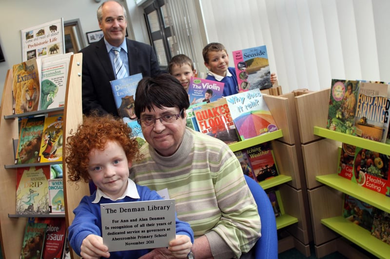 Pupils at Abercrombie Primary school enjoy their new library. 6 year old Charlotte Thompson with Ann Denman former govenor, Head teacher Mr Neil Jones. with William and Philip Riley aged 8