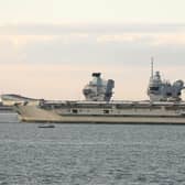 HMS Prince of Wales is  tugged towards Stokes Bay after breaking down in the Solent Picture: Mark Cox