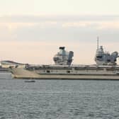 HMS Prince of Wales is  tugged towards Stokes Bay after breaking down in the Solent Picture: Mark Cox