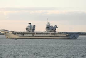 HMS Prince of Wales is  tugged towards Stokes Bay after breaking down in the Solent Picture: Mark Cox