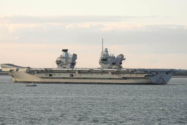 HMS Prince of Wales is  tugged towards Stokes Bay after breaking down in the Solent Picture: Mark Cox