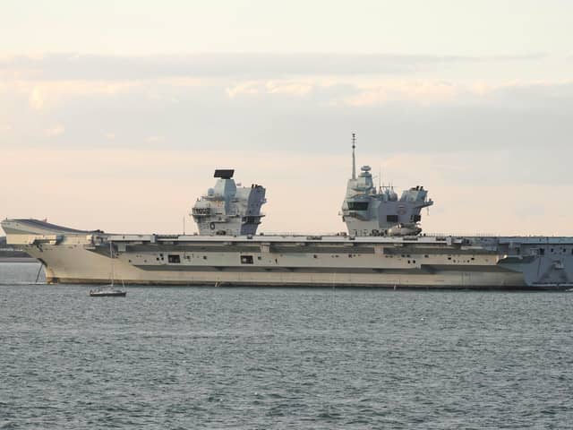 HMS Prince of Wales is  tugged towards Stokes Bay after breaking down in the Solent Picture: Mark Cox