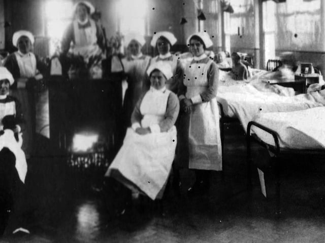 Sisters at The Royal Hospital Haslar in Gosport, huddle around a real coal fire in this undated picture