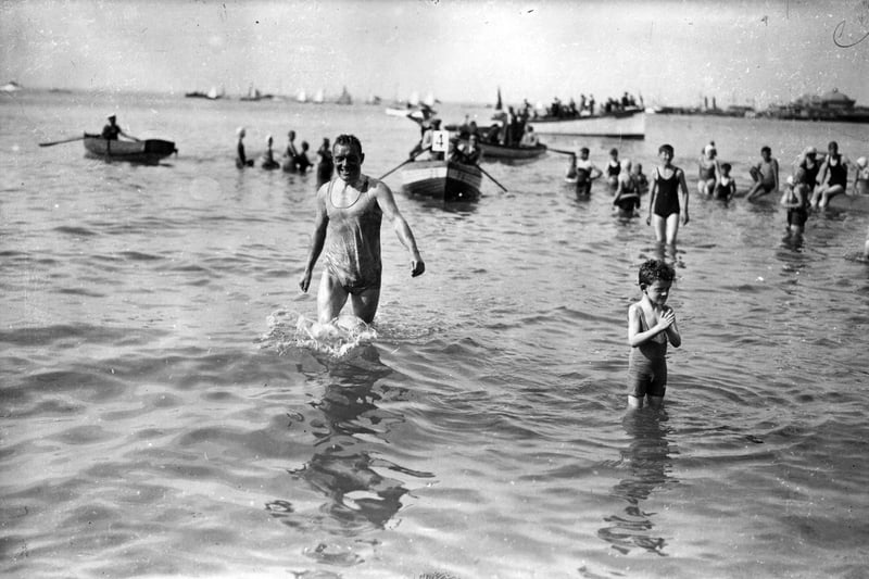 20th August 1936:  Mr C Rogers of the Gosport Swimming Club wades ashore at Ryde after his winning swim from Southsea to the Isle of Wight, which he won by the narrow margin of 19 seconds in a record time of 2 hours 8 minutes 5 seconds.  (Photo by J. A. Hampton/Topical Press Agency/Getty Images)