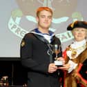 Promising young sailor Leading Engineering Technician Daniel Harrison receiving the HMS Collingwood Award from the retiring Mayor of Fareham Susan Bayford. Daniel died while serving on HMS Kent earlier this month. Picture: Sarah Standing (090519-8710)
