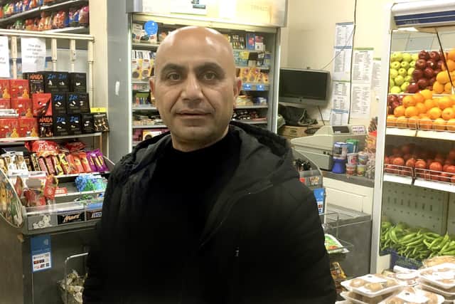 Khoshnaw Agah, owner of the Mediterranean Supermarket in Elm Grove, had concerns about the new bike lanes.