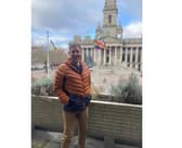 Councillor Chris Atwell with the pride flags in front of the Portsmouth City Council offices. Picture: PCC
