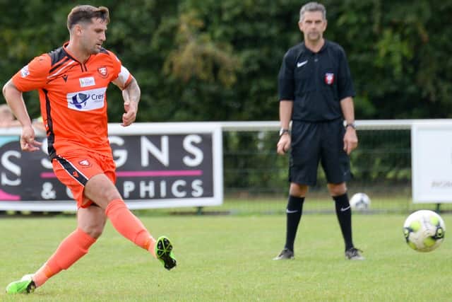 Portchester's Steve Ramsey about to see his penalty saved by Bemerton's Patrick Creese. Pic Martyn White.