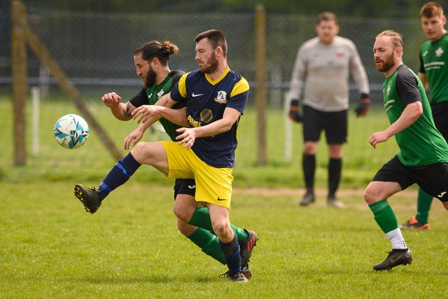 Action from Saturn Royale's 1-0 win over Pelham Arms (blue and yellow kit) in the second Adelaide Cup semi-final. Picture: Keith Woodland (300421-923)