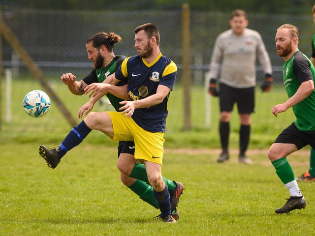 Action from Saturn Royale's 1-0 win over Pelham Arms (blue and yellow kit) in the second Adelaide Cup semi-final. Picture: Keith Woodland (300421-923)