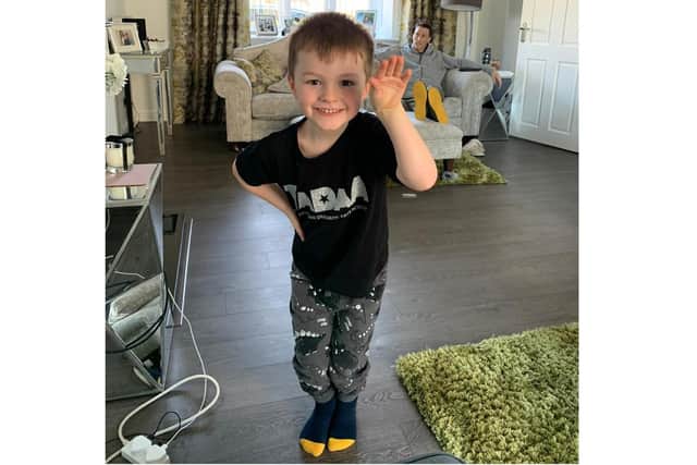 Helen Wallis from TADAA made a donation to Rowans Hospice after the charity helped the family of one of her young students. Pictured: Seb enjoying a TADAA lesson with dad Sean in the background