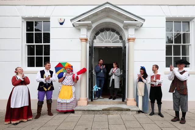 The cast of Beauty and The Beast celebrate at the official opening of the building's restored frontage, Groundlings Theatre, Kent St, Portsea. Cutting the ribbon are Cllr Kirsty Mellor and Cllr Cal Corkery, both of whom are ward councillors for the Charles Dickens ward. The actors are, from left, Megan Crawford, James Edge, Keith Myers, Phoebe Saunders, Adam Boyle and Alasdair Baker
Picture: Chris Moorhouse   (jpns 191021-11)