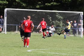 Moneyfields striker Will Porter puts  his side ahead at Paulsgrove on Bank Holiday Monday. Picture: Sam Stephenson.