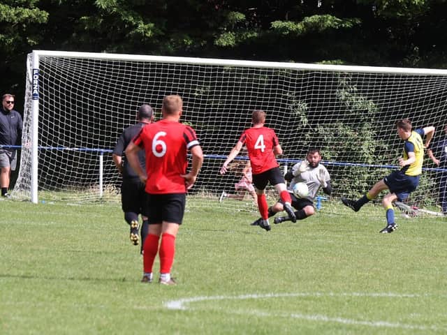 Moneyfields striker Will Porter puts  his side ahead at Paulsgrove on Bank Holiday Monday. Picture: Sam Stephenson.